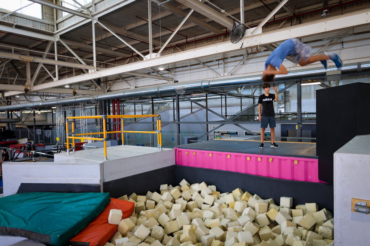 Athlete launching into the foam pit
